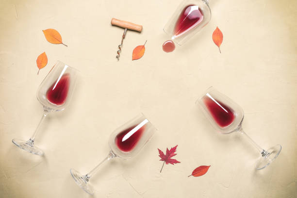 products/flat-lay-of-red-wine-in-glasses-with-corkscrew-and-autumn-leaves-on-picture-id1327531448_2dbfe94e-3953-47fb-8050-ae4204dee276.jpg